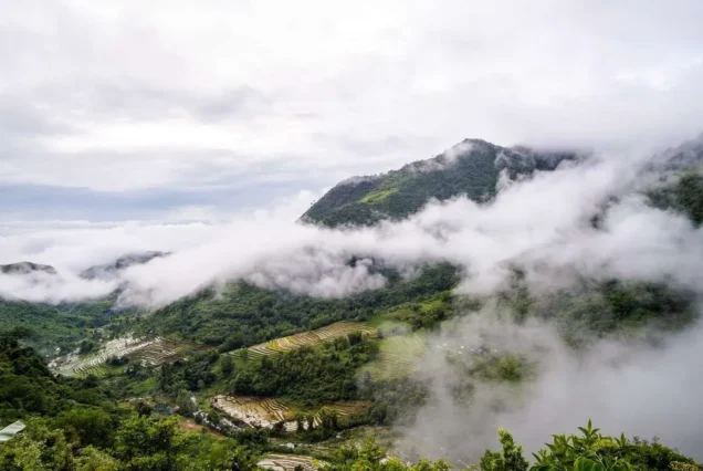 Scenic mountain landscape in Don Salvador Benedicto, Negros Occidental, surrounded by lush greenery and rolling hills.