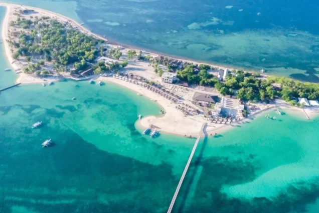 Scenic view of Lakawon Beach Resort surrounded by tropical island waters. Title: Lakawon Island Getaway