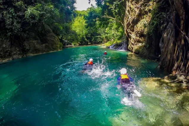 Canyoneering adventure through waterfalls and natural pools in Badian, Cebu.