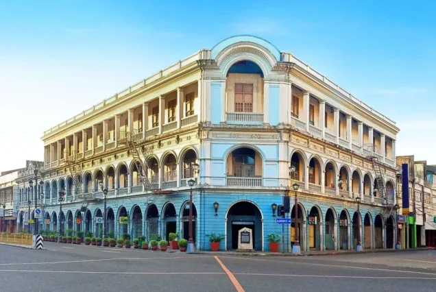 Calle Real in Iloilo City, featuring historic heritage buildings, commercial establishments, and a lively urban streetscape.
