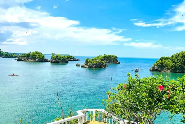 Guimaras island-hopping boat cruising through the clear waters and scenic coastal islands of Guimaras.