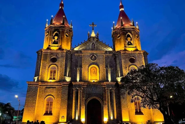 Molo Church in Iloilo City, featuring its historic Gothic Revival architecture and distinctive red-and-white façade.