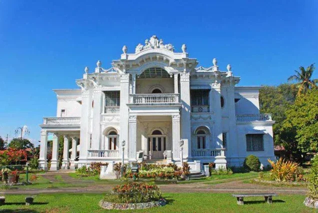 Nelly's Garden in Iloilo City, showcasing an elegant heritage mansion surrounded by landscaped gardens.