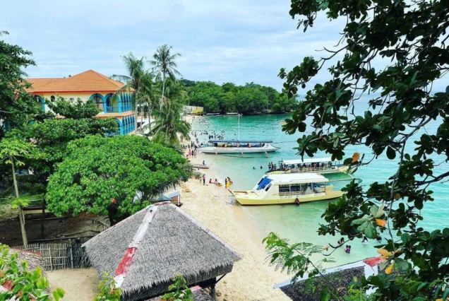 Raymen Beach in Guimaras, featuring a scenic tropical shoreline, clear waters, and a relaxing island atmosphere.