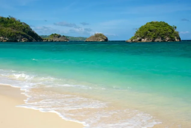 Ilig-Iligan Beach in Boracay, Aklan, featuring clear turquoise waters, white sand, and lush tropical surroundings.
