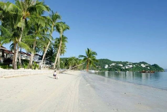 Bulabog Beach in Boracay, Aklan, featuring a scenic coastline, clear blue waters, and tropical island surroundings.